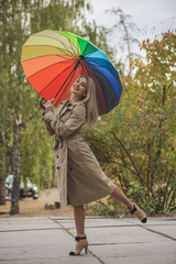 Woman at autumn in fashionable beige coat, vogue and clothes concept