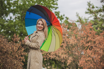 Woman at autumn in fashionable beige coat, vogue and clothes concept