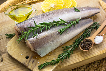   Save Download Preview Fresh raw carcass of hake, greenery and lemon . Ingredients for a fish dish