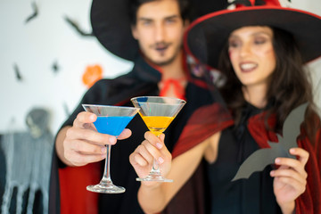 happy couple of love  in costumes and makeup on a celebration of Halloween