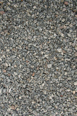 Fragment of garden path. Loose gravel. Gray small stones
