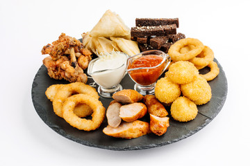 Fast food snacks composition with beer. Unhealthy junk food
