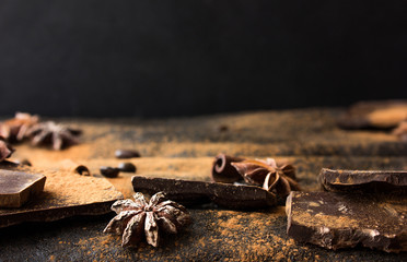 Sweet spices ,  chocolate on a table black