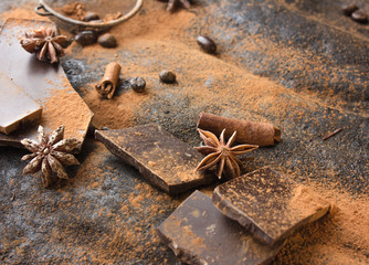 Sweet spices ,  chocolate on a table black