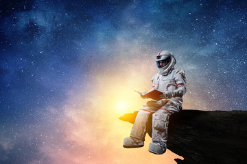 Spaceman and the planet Earth abstract theme - obrazy, fototapety, plakaty