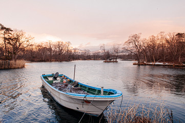 Fishing boat at Onuma Koen Quasi -National park in peaceful cold winter. Hakodate, Hokkaido - Japan