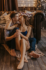 Romantic couple in love feeling happiness about their romance spending christmas eve together- Image