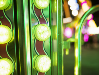 Rows of brightly colorful funfair lights