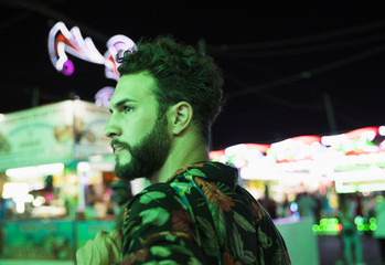Fototapeta premium Man at funfair looking away