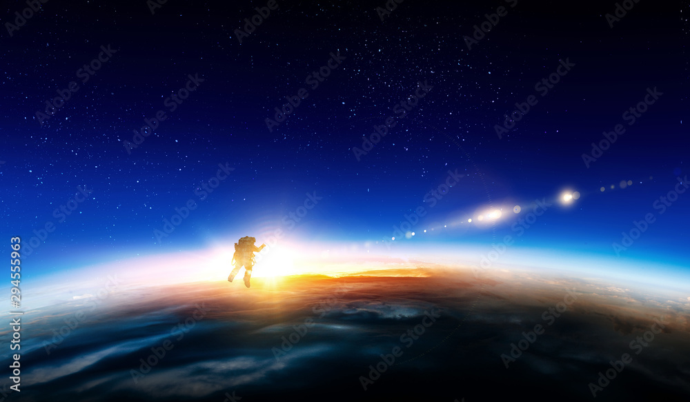 Wall mural spaceman and planet, human in space concept