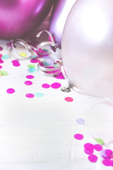 Colorful balloons on white background; party background with copy space