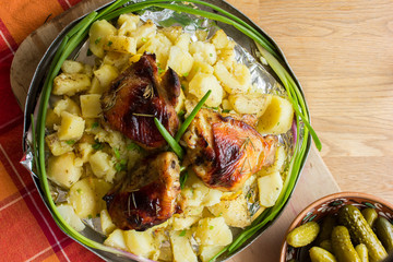   Save Download Preview Baked in oven potato, chiken, asparagus, cherry tomato in baking pan over on deep blue background. Overhead.