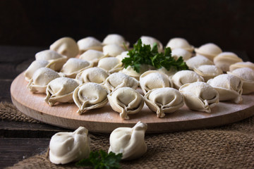 Raw Russian dumplings on the cutting board. 