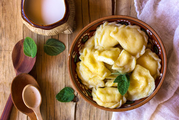 Preparing dumplings with cottage. making pierogi or pyrohy, varenyky, vareniki. Traditional Russian cuisine, The traditional Ukrainian handmade vareniki (dumpling) with cottage cheese inside