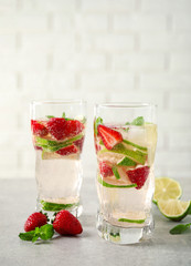 Tasty refreshing drink on light grey table. Space for text