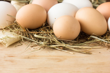 Raw brown eggs in bowl. Eggs in shells - macro shot with shallow depth of field.