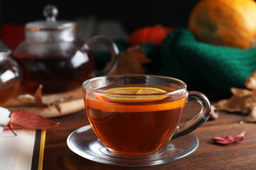 Cup of hot drink on wooden table. Cozy autumn atmosphere