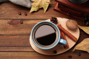 Fototapeta na wymiar Flat lay composition with cup of hot drink on wooden table. Cozy autumn atmosphere