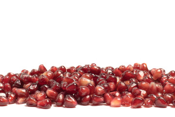 ripe pomegranate berries on a white background