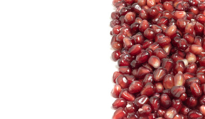 ripe pomegranate berries on a white background