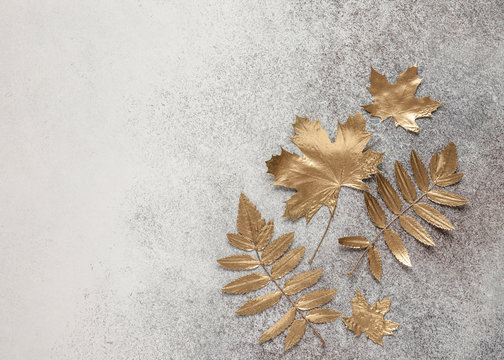 Autumn Gold Leaves On Stone Grey Background. Flat Lay, Top View.