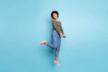 Full length body size photo of cheerful cute charming nice jumping black millennial girlfriend...