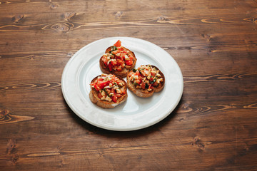 Italian bruschetta on wooden table