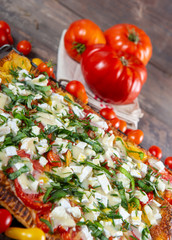 vegetarian homemade pizza with tomatoes and cheese