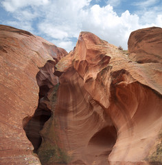 Looking up at Lower Antelope canyon entrance, crack in the solid red rock
