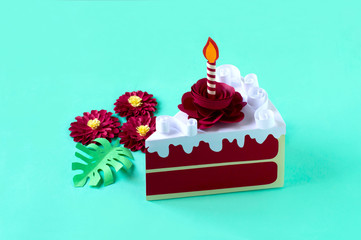 Paper red velvet cake with burning candle