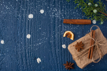 White Christmas card, on New Year's holiday background. Christmas tree branch, cookies. toys. Top view for design.