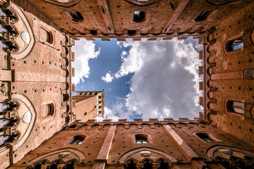 Siena - View from inside the Palazzo Pubblico at Piazza del Campo - old historic city in Italy