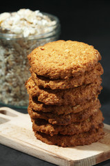 Homemade oatmeal cookie at dark background	
