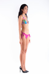 Full body shot of beautiful Asian woman wearing bikini