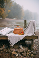 picnic on a foggy morning by the lake. Autumn concept