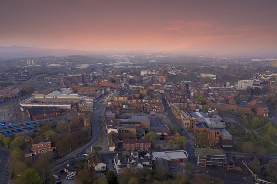 Dudley town centre at sunrise with pink clouds and quiet streets aerial