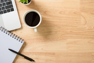 Flay lay, Top view office table desk with smartphone, keyboard, coffee, pencil, leaves with copy...