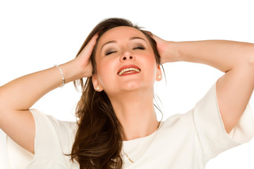 Fototapeta premium Youngs happy woman holding her hair on white background