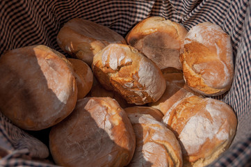 Fresh baked artisanal rustic bread close-up, top view. Traditional Spanish artisanal bread, with...