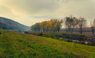 Sunrise over a misty small river