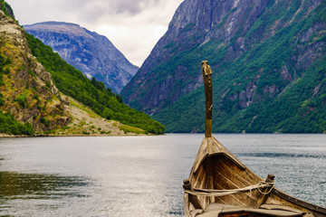 Old viking boat on fjord shore, Norway