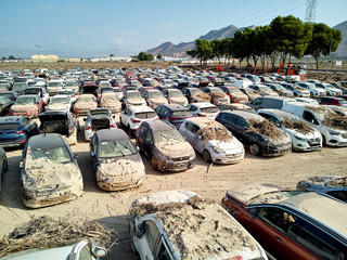 Aerial view new damaged cars due to flooding in dirt, spoiled can not be restored and used, gota...