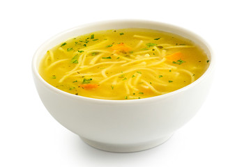 Instant chicken noodle soup in a white ceramic bowl isolated on white.