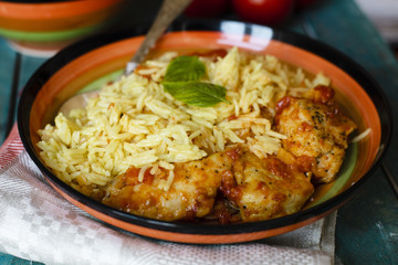 Traditional indian dish with rice and chicken close-up