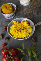 Delicious indian meal with rice and tomatoes