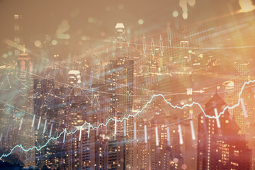 Double exposure of forex chart drawings over cityscape background. Concept of success.