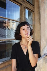 Closeup portrait of smoking girl