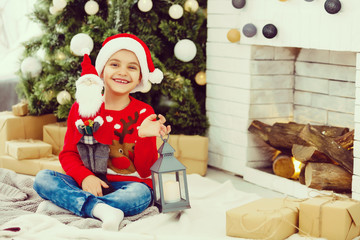 Obraz na płótnie Canvas Little boy with Christmas presents