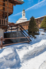 Winter in Sauris di Sotto. Magic of snow and old wooden houses. Italy