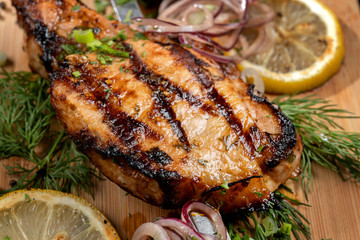 Juicy barbecue pork ribs beer, snacks lie on a wooden tray.